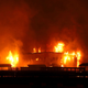 A structure being burned by the Kincade Fire.